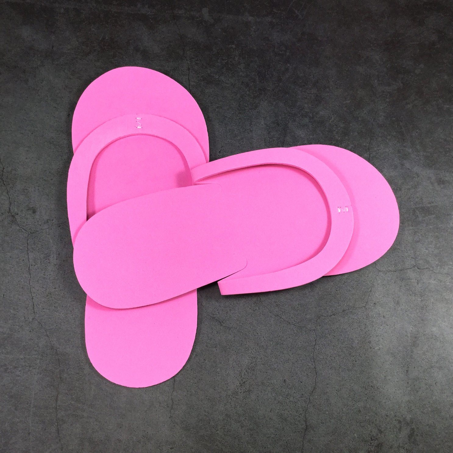 What are pedicure slippers typically made of